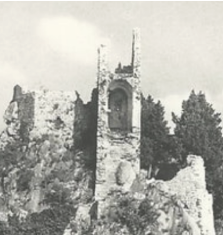 Black and white image depicting a castle on a cliff over a body of water